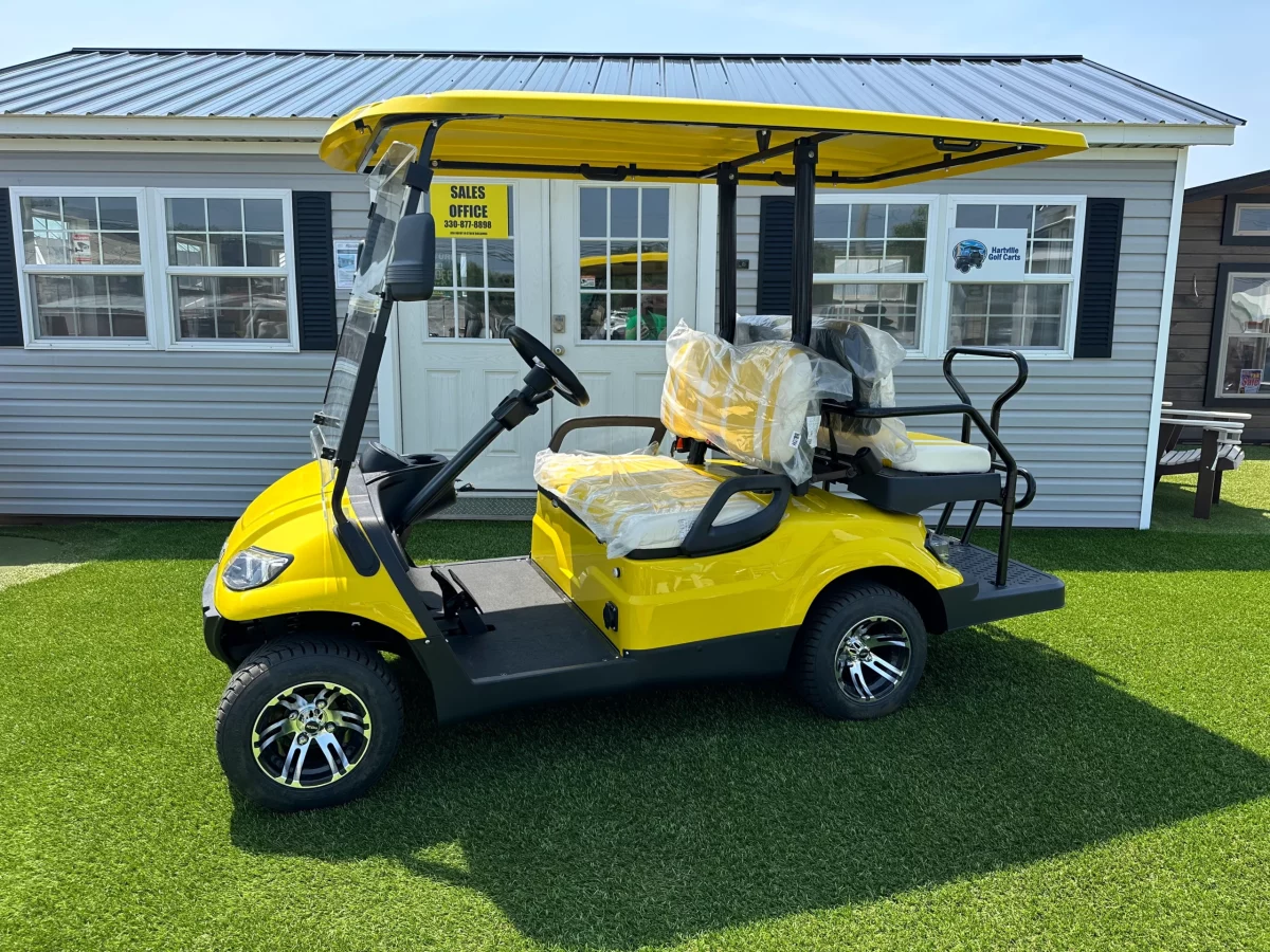 white and yellow golf carts